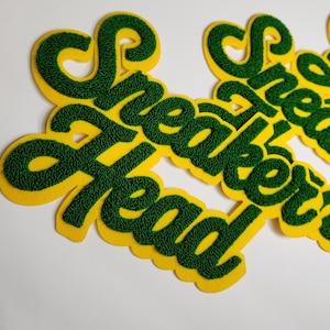 Parche de chenilla "Cabeza de zapatilla" (1 pieza), color verde y amarillo/dorado, para coser en chaquetas, sudaderas y para hombre y mujer, de 25 x 15 cm.