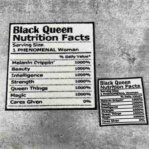 May include: Two white rectangular patches with black borders and text that reads "Black Queen Nutrition Facts." The larger patch lists "Melanin Drippin'," "Beauty," "Intelligence," "Strength," "Queen Things," and "Magic."