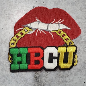 May include: Embroidered patch with a red lip design, gold chain, and the letters "HBCU" in green, red, white, and gold.