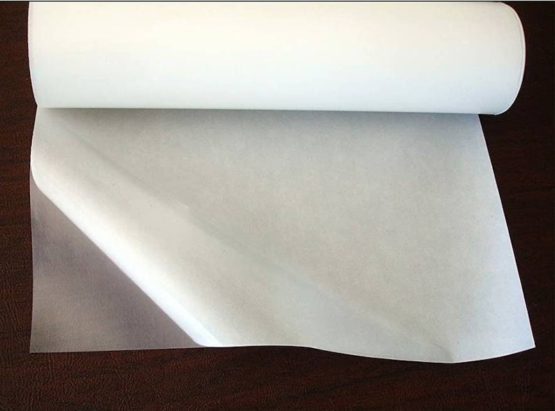 May include: A roll of white adhesive-backed fabric, with one end unrolled to show the adhesive side.