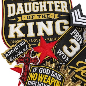 May include: A collection of embroidered patches featuring black, gold, and red themes. Text includes DAUGHTER OF THE KING, ANOINTED & UNBOTHERED, and IF GOD SAID NO WEAPON THEN NO WEAPON MEANS NO WEAPON. Includes a red star, a cross, and gold sequins.