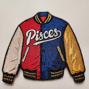 May include: An embroidered iron-on patch of a red, white, and blue varsity jacket with the word "Pisces" in white cursive lettering.