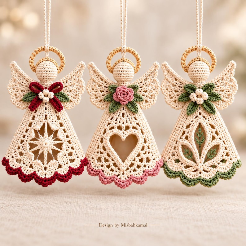 May include: Three hanging crochet angel ornaments in cream yarn with gold halos. Each features a unique center cutout: a star, a heart, and a leaf motif. They are accented with red, pink, or green floral details and matching scalloped hems. Text reads: Design by Misbahkamal.