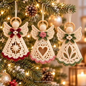 May include: Three cream-colored crocheted angel ornaments hanging from a tree. Each angel features a golden halo, intricate lace patterns, and unique embellishments: a red bow, a pink rose, or green leaves. Text at the bottom reads Design by Misbahkamal.
