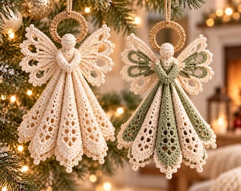 May include: Two crocheted angel ornaments hanging from a tree. One is solid cream, the other is cream and sage green. Both feature intricate lace-like wings, a round head, and a flared, pleated skirt with a gold-colored halo ring at the top.