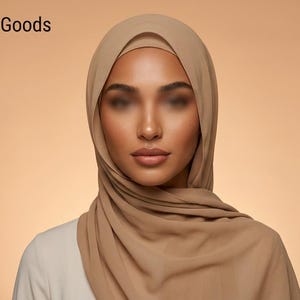 May include: A solid tan hijab worn over a white top. The text Simple Hijabi Goods Elegant Modesty appears in the top left corner, and a circular logo with the text Simple Hijabi Goods is positioned in the top right corner of the image.