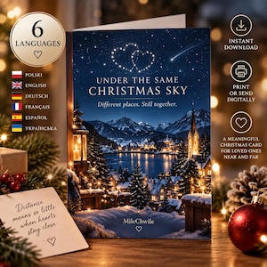 May include: A greeting card featuring a dark blue night sky with two heart-shaped constellations and a shooting star above a snowy mountain village by a lake. The text reads: UNDER THE SAME CHRISTMAS SKY, Different places. Still together. MileChwile.