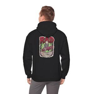 May include: A black hooded sweatshirt featuring a graphic on the back. The design shows a skeleton with a mohawk riding a checkered skateboard inside a bowl. Above the skeleton, the word RAD is written in red, with the text SKATE OR DIE below.