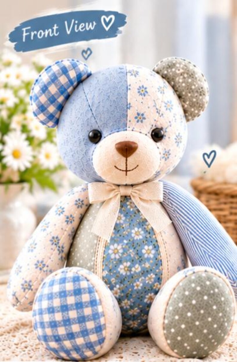 May include: A patchwork teddy bear featuring various blue, white, and sage green fabric patterns including gingham, floral, and polka dots. The bear has black button eyes, a brown nose, and a cream-colored ribbon bow at the neck. Text reads Front View.