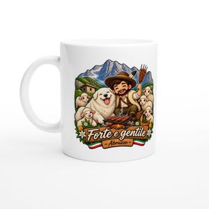 May include: A white ceramic mug featuring a colourful illustration of a smiling person in a hat, a large white dog, and several small sheep in a mountain landscape. The graphic includes a grill with skewers and the text "Forte e gentile - Abruzzo".