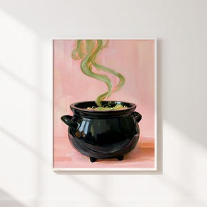 May include: A black cauldron with two side handles sits on a pink surface. Inside the pot, a bubbling green liquid emits swirling green steam that rises upward against a solid, light pink background in this artistic illustration.