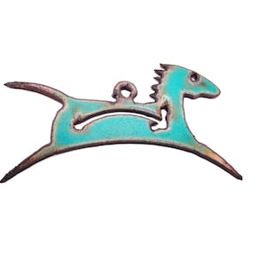 May include: A turquoise enamel horse pendant with a running pose. The pendant has a dark brown outline and a loop for hanging. The horse is a stylized design, suitable for jewelry or craft projects.