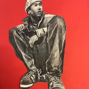 May include: A black and white charcoal drawing of a person in a beanie, jacket, and jeans, crouching down. The figure is rendered in shades of grey and black, set against a solid, vibrant red background, capturing a seated pose with hands resting.