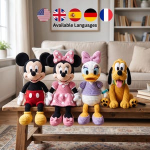 May include: Four crocheted plush dolls featuring Mickey Mouse, Minnie Mouse, Daisy Duck, and Pluto. Each character is crafted with yarn, displaying their signature colors and outfits, including red shorts, a pink polka-dot dress, and a purple top.