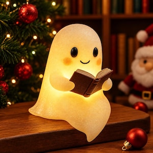 May include: A glowing, translucent, off-white ghost figurine with a smooth, rounded shape, black eyes, and pink cheeks. The ghost is holding a small, open brown book in its hands, emitting a warm, soft light from within its hollow body.