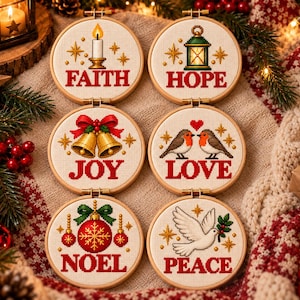 May include: Six circular wooden embroidery hoops containing cross-stitch designs with Christmas themes. The designs feature a candle, lantern, bells, birds, ornament, and dove, with the words FAITH, HOPE, JOY, LOVE, NOEL, and PEACE in red.