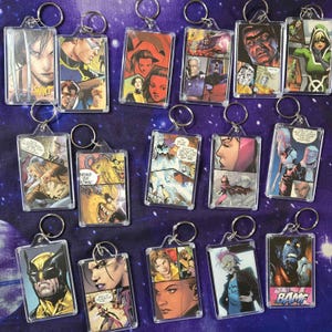 May include: A white ceramic mug with a black handle and the text "But First, Coffee" in a black, handwritten-style font. The mug is on a white surface.