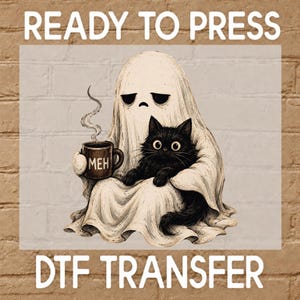 May include: A DTF transfer featuring a white ghost with a sad expression holding a brown mug with the text MEH and steam rising from it. A fluffy black cat sits in the lap of the ghost. The text READY TO PRESS DTF TRANSFER is visible.