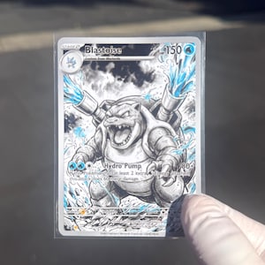 May include: A Blastoise trading card featuring a black and white sketch-style illustration of the character with blue water effects. The card displays the name Blastoise, 150 HP, and the Hydro Pump attack text in a clear protective sleeve.