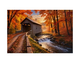 May include: A wooden covered bridge spans a small stream with a waterfall, surrounded by trees with vibrant orange and yellow autumn foliage. A dirt path covered in fallen leaves leads to the bridge, with a wooden railing along the side.