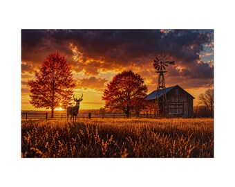 May include: A landscape photograph featuring a deer standing in a golden field at sunset. Two large trees with orange autumn foliage flank a rustic wooden barn with a metal windmill. A dark fence runs across the horizon under a dramatic cloudy sky.