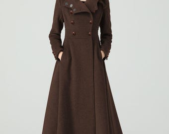 May include: A long, brown wool coat with a double-breasted design. The coat features a wide collar, button details, and pockets. The coat is knee-length and is paired with black boots.