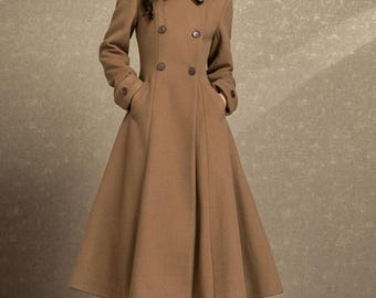 May include: A long, camel-colored wool coat with a double-breasted closure and a flared skirt. The coat features a classic collar, pockets, and buttoned cuffs. The coat's length is approximately 55 inches.
