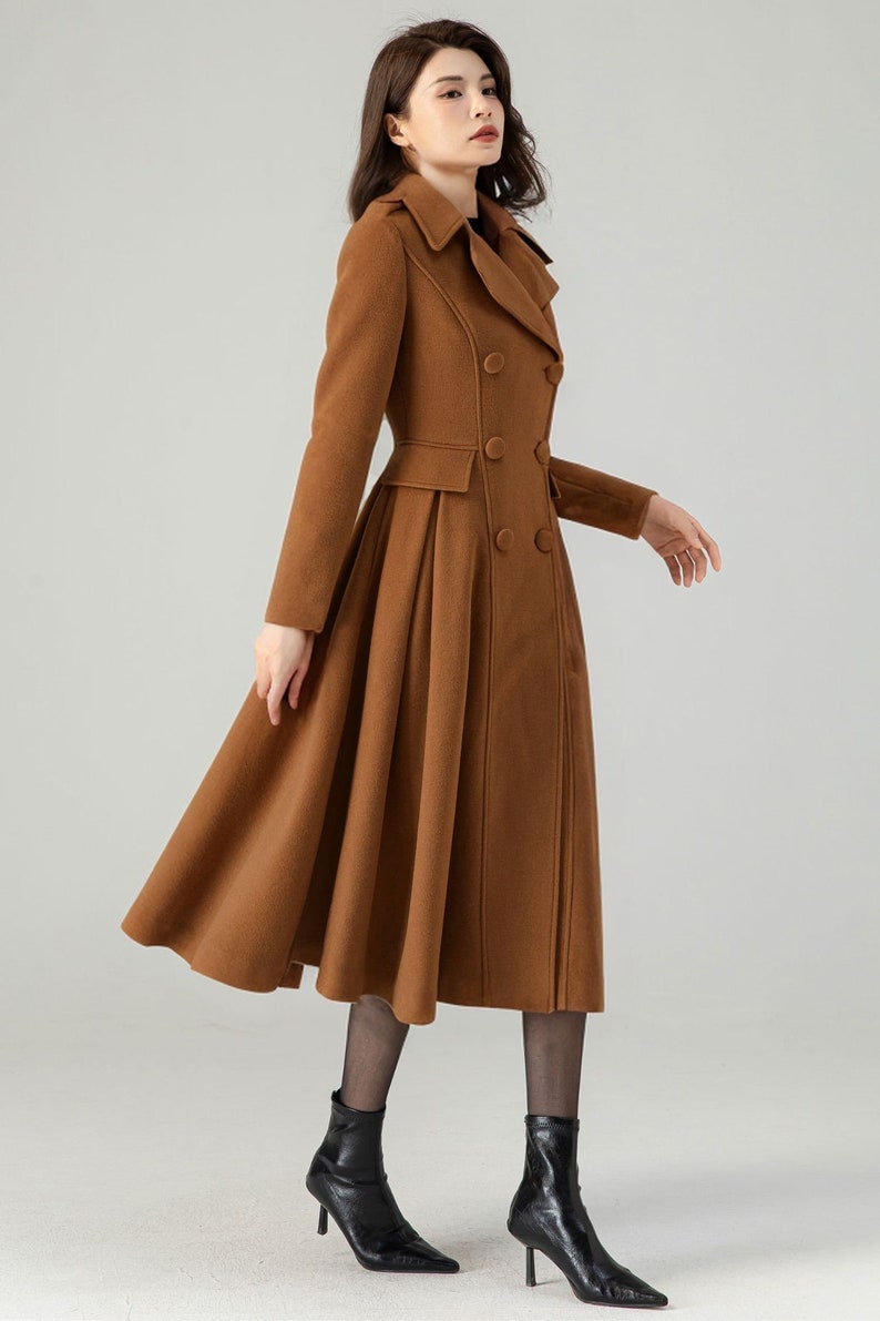 May include: A brown double-breasted wool coat with a flared skirt and a high collar.