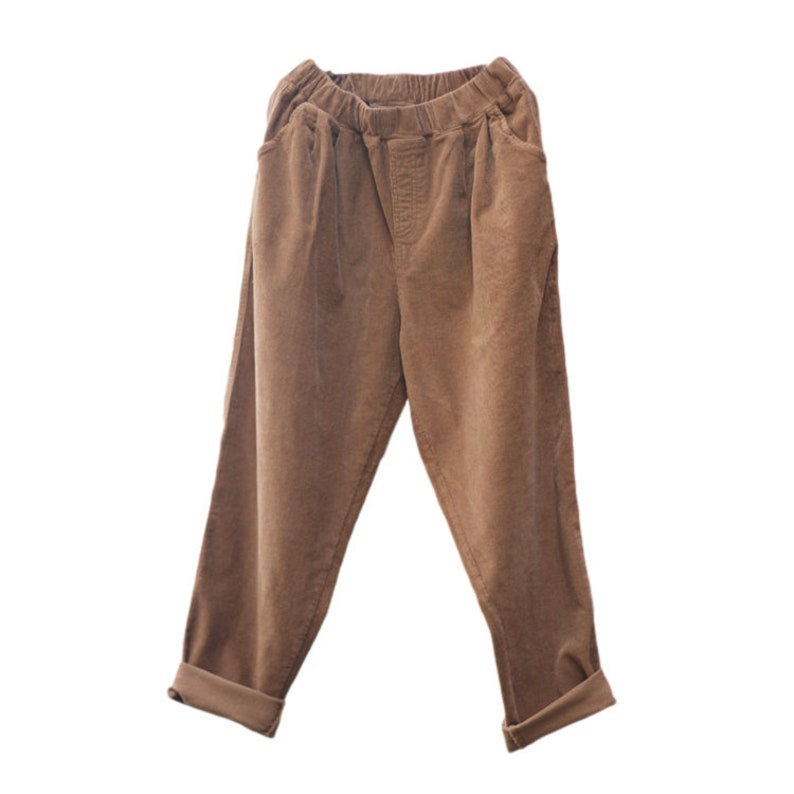 May include: Brown corduroy pants with a relaxed fit and a drawstring waist.