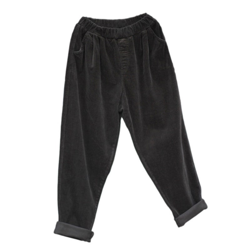 May include: Black corduroy pants with a wide leg and a cuffed hem.