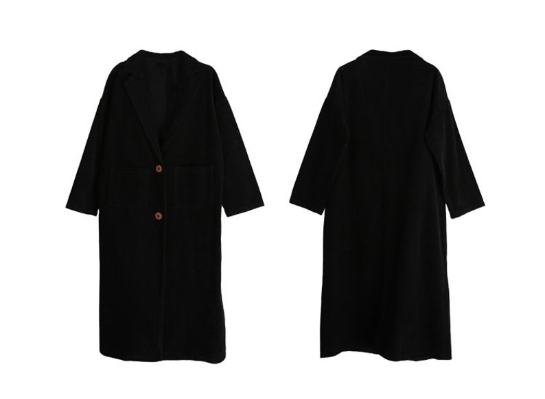May include: A black long-sleeved coat with a collar and two buttons. The coat has a pocket on the left side.