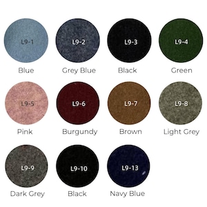 May include: A color chart featuring circular fabric swatches in various shades. Colors include blue, grey blue, black, green, pink, burgundy, brown, light grey, dark grey, and navy blue. Each swatch is labeled with a code.