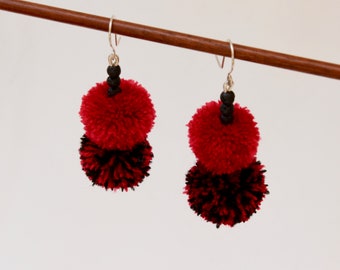 Dangling double pompom earrings, red and black, with lava beads