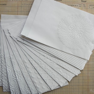Sacchetti regalo con disegni in carta bianca in rilievo, set da 15