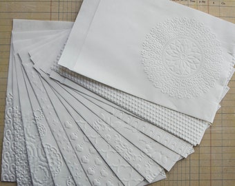 Gift bags with embossed motifs, white paper, set of 15