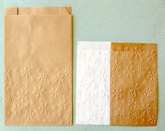 Embossed kraft bags with stars and snowflakes pattern