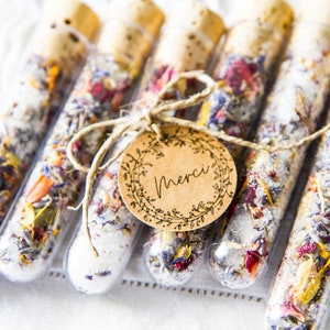 Test tubes filled with Epsom salt and dried flowers.