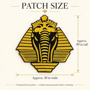 May include: An embroidered patch featuring a gold and black pharaoh mask design. The patch is approximately 25.4 cm tall and 25.4 cm wide. The text PATCH SIZE is at the top, with measurement indicators for height and width included.