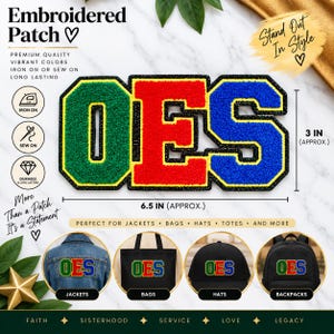 May include: An embroidered patch featuring the letters OES in green, red, and blue with a black border. The patch measures approximately 16.5 cm wide by 7.6 cm high. It is shown applied to a denim jacket, a black tote bag, a black hat, and a backpack.