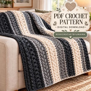 May include: A crochet blanket featuring vertical stripes in cream, light gray, and dark charcoal gray with a textured cable stitch pattern. A label reads PDF CROCHET PATTERN DIGITAL DOWNLOAD and ROSECROCHETBYUMAIMA.