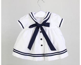 Vestido marinero niña - Blanco con ribetes y lazo azul marino