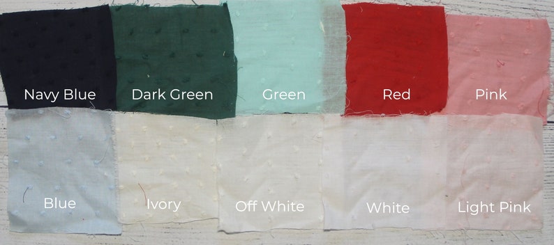 May include: A collection of fabric swatches in various colors, including navy blue, dark green, green, red, pink, blue, ivory, off white, white, and light pink. Each swatch has a textured surface and a label indicating its color.