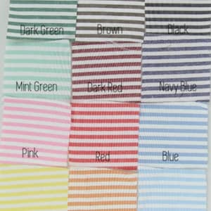 May include: A collection of striped fabric swatches in various colors, including dark green, brown, black, mint green, dark red, navy blue, pink, red, blue, yellow, orange, and light blue. Each swatch has horizontal white stripes.