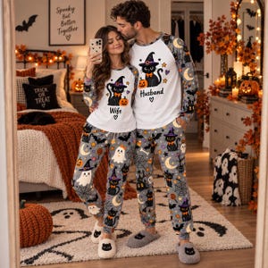 May include: Matching long-sleeve pajama sets featuring a white top with a black cat wearing a witch hat and the text Wife or Husband. The gray pants are covered in a pattern of black cats, ghosts, pumpkins, moons, and spiderwebs.