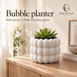 May include: A white cylindrical planter with a textured bubble surface containing a green succulent plant. The text "Bubble planter" and "Soft curves. A little everyday green." is visible above the object, along with the Orenvale Studio logo.