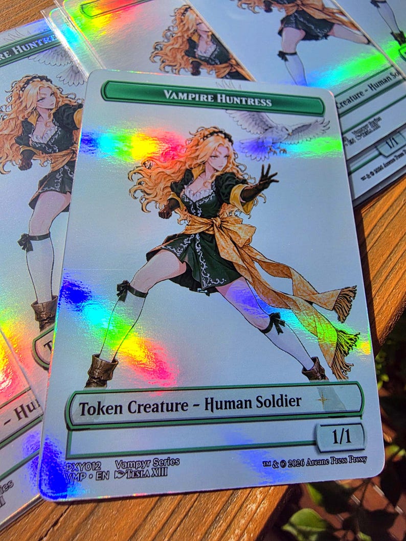 May include: A rectangular holographic trading card titled Vampire Huntress, featuring an illustration of a blonde character in a dark green dress with a yellow sash, white stockings, and brown boots, accompanied by a white owl, with text Token Creature - Human Soldier.