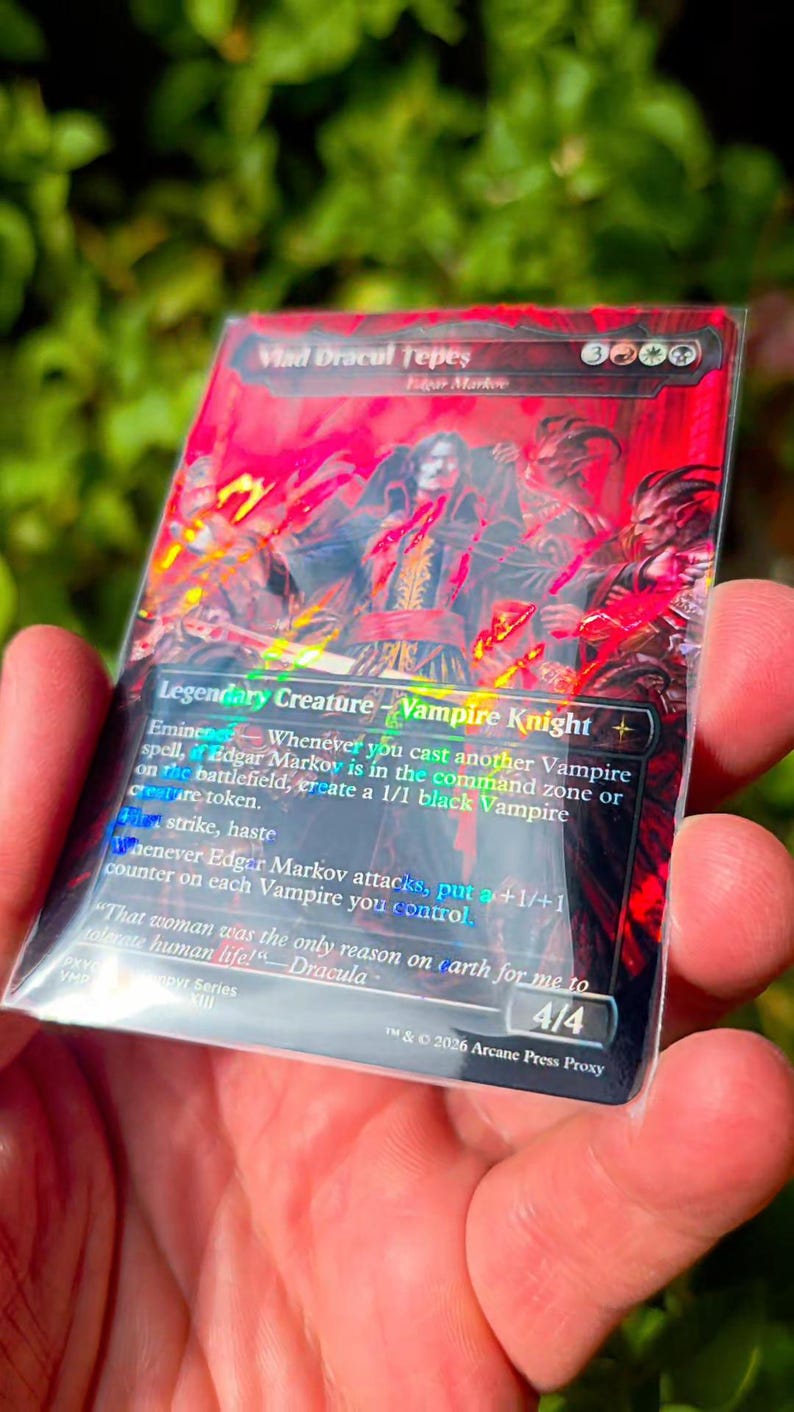 May include: A rectangular trading card featuring a red and black illustration of a vampire knight. The text reads Vlad Dracul Tepes, Edgar Markov, Legendary Creature - Vampire Knight, and includes game rules, a flavour quote, and 4/4 at the bottom.