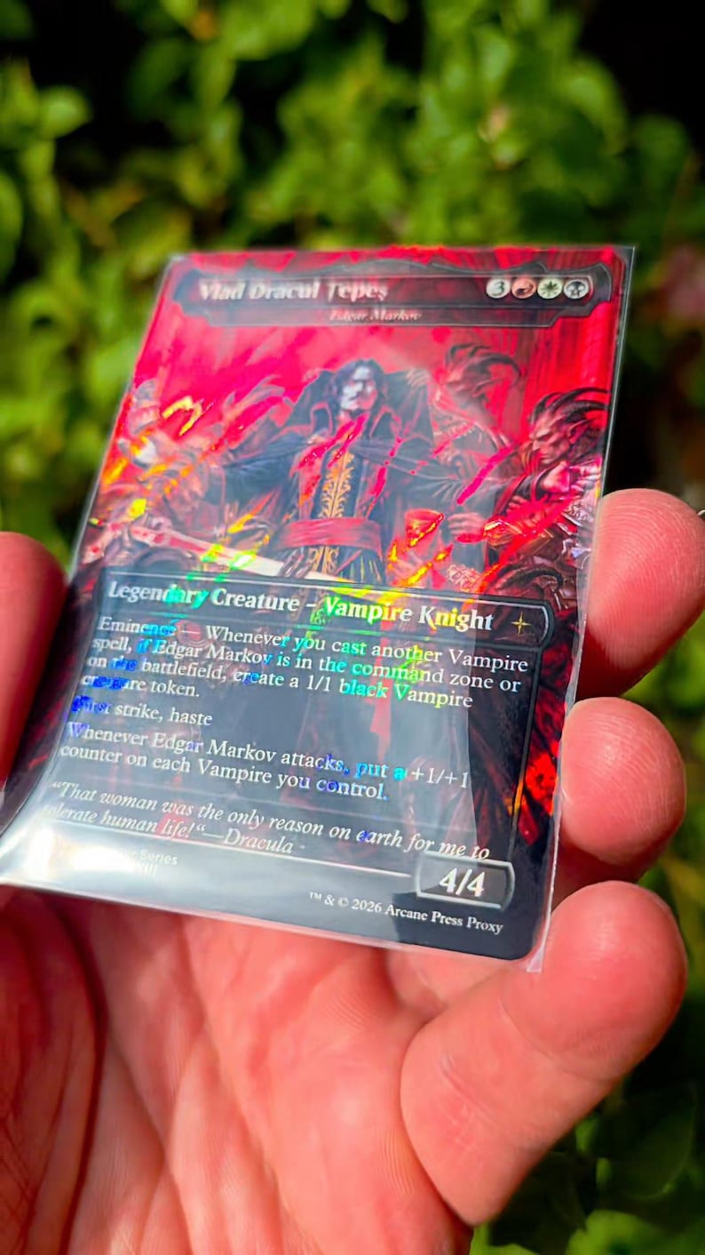 May include: A rectangular trading card featuring a red-toned illustration of a vampire character titled Vlad Dracul Tepes. The card text includes Legendary Creature, Vampire Knight, and the quote That woman was the only reason on earth for me to tolerate human life!&mdash;Dracula.