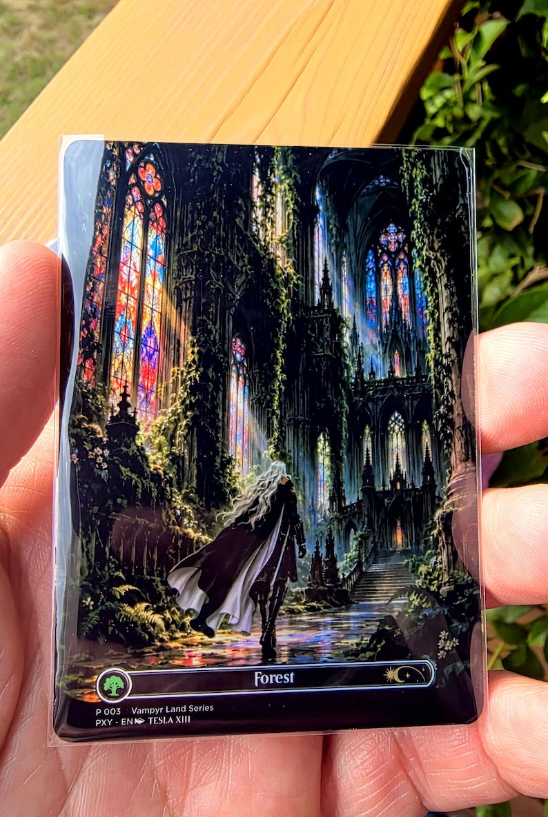 May include: A rectangular trading card featuring a dark, gothic cathedral interior overgrown with vines and illuminated by colorful stained glass windows. A figure with long white hair and a dark cloak stands in the center. Text reads Forest, P 003, Vampyr Land Series, PXY-EN, TESLA XIII.