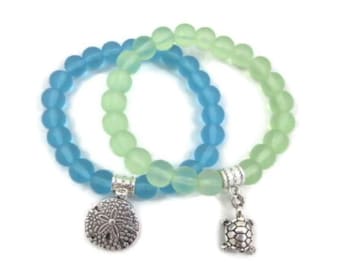 Glass Stretch bracelets with turtle or sand dollar charm; beach bracelets